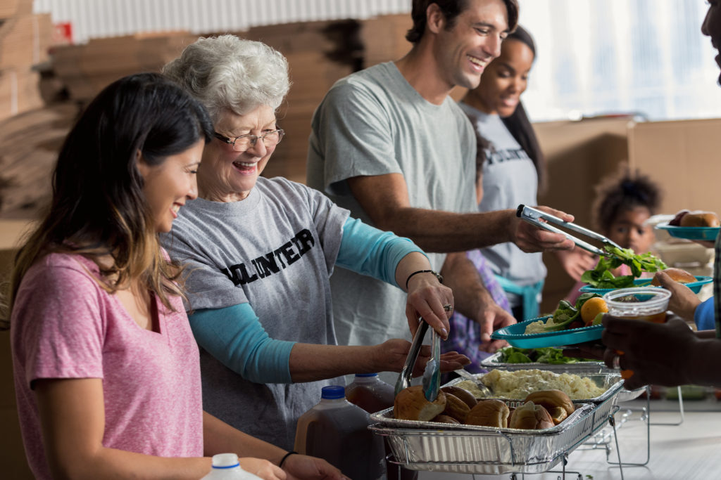 Volunteers serving food Volunteers serving food
